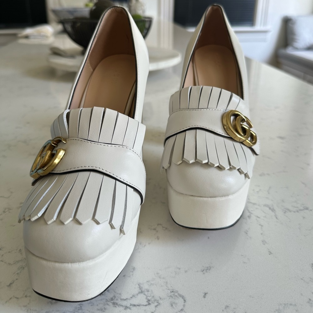 Super cute. GG platform heel is a cream color. Worn 1x, fits size 8-8.5